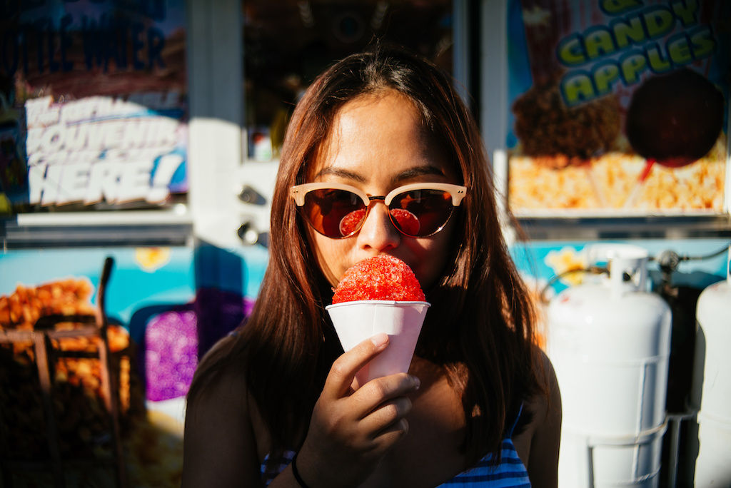 Girl tasting a snowcone